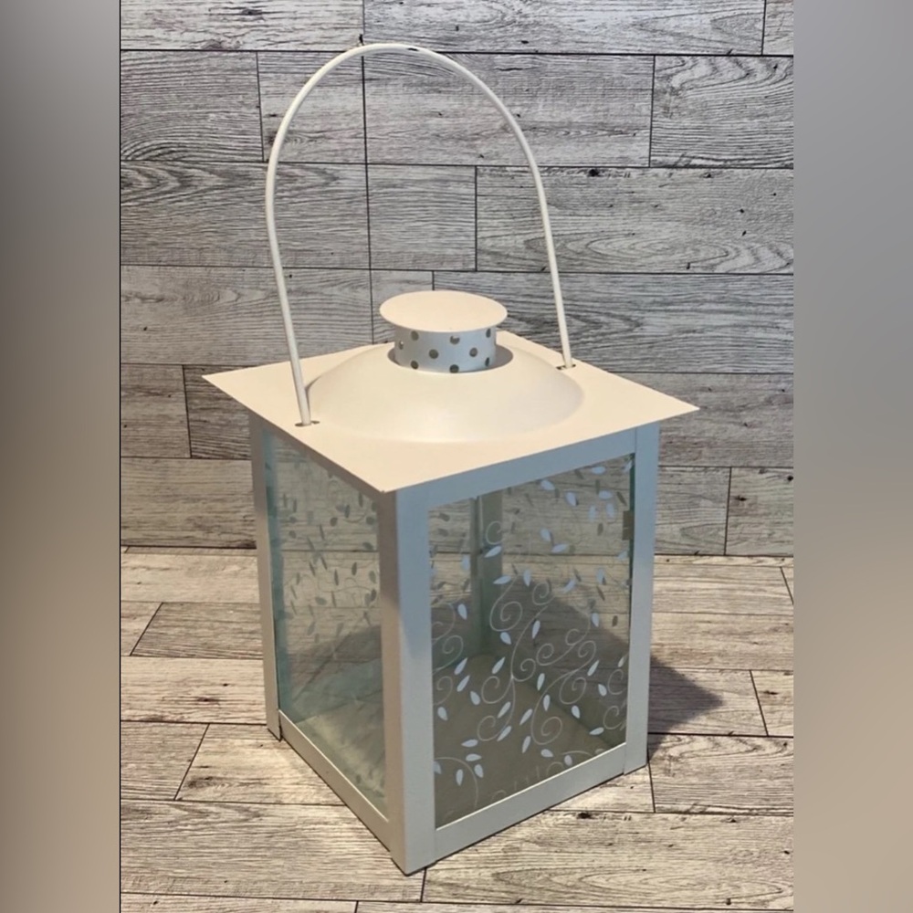 White Lantern with Elegant Accents and Nature-Inspired Design